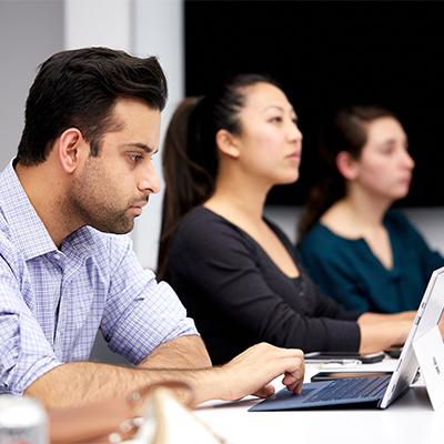 Students sitting at desk in class.